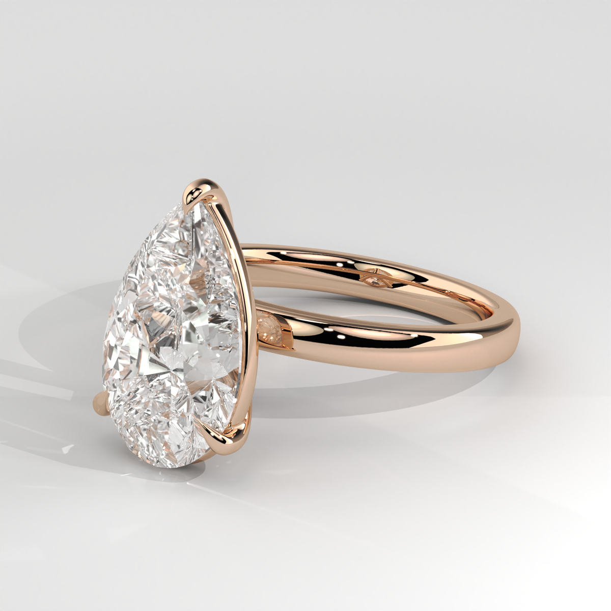 Pear Cut Solitaire Engagement Ring - Rose Gold